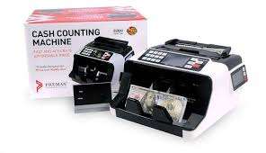 Premax Cash Counting Machine PM-CC100A in a retail setup